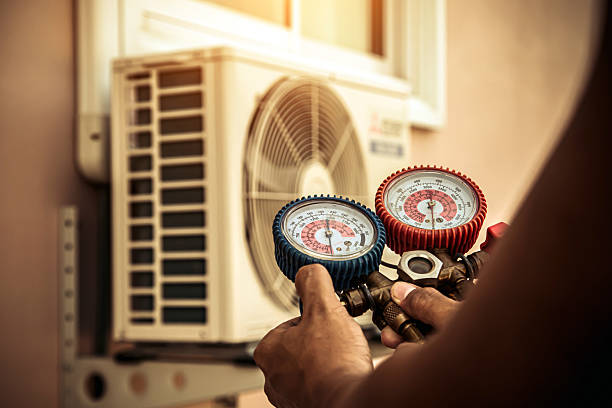 Professional Air Conditioning Service technician working in Minetto, NY